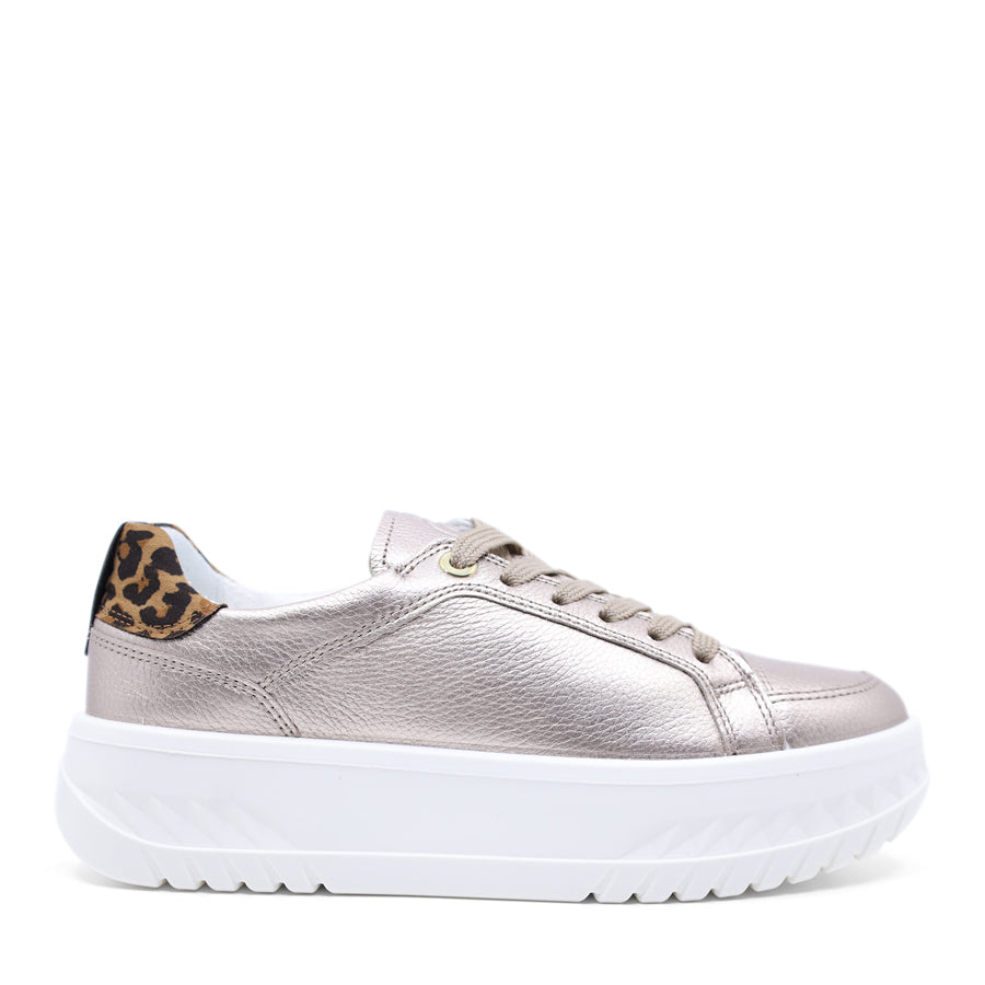 Silver metallic sneaker with leopard print accents on a white background