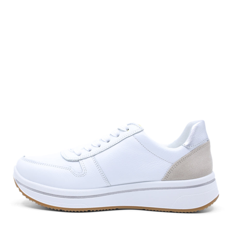 White sneaker with a grey and yellow patch on a white background