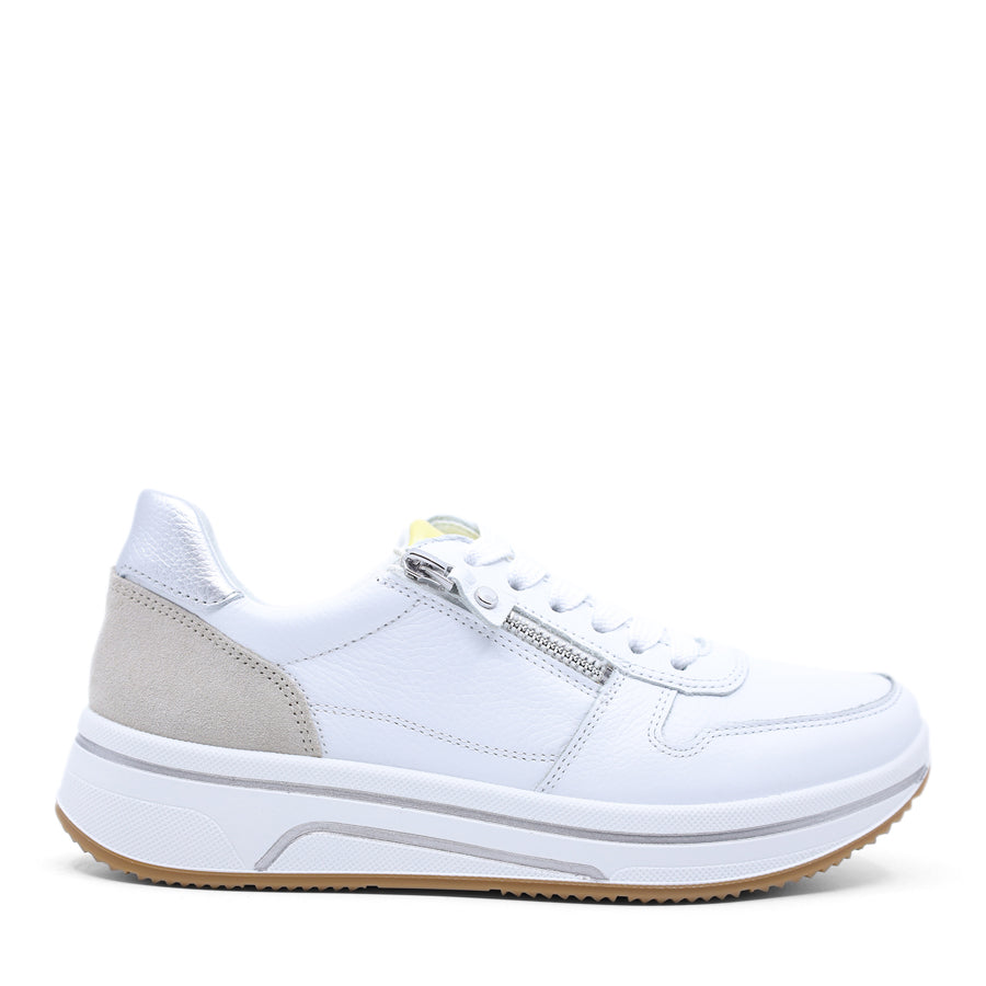 White sneaker with a grey and yellow patch on a white background