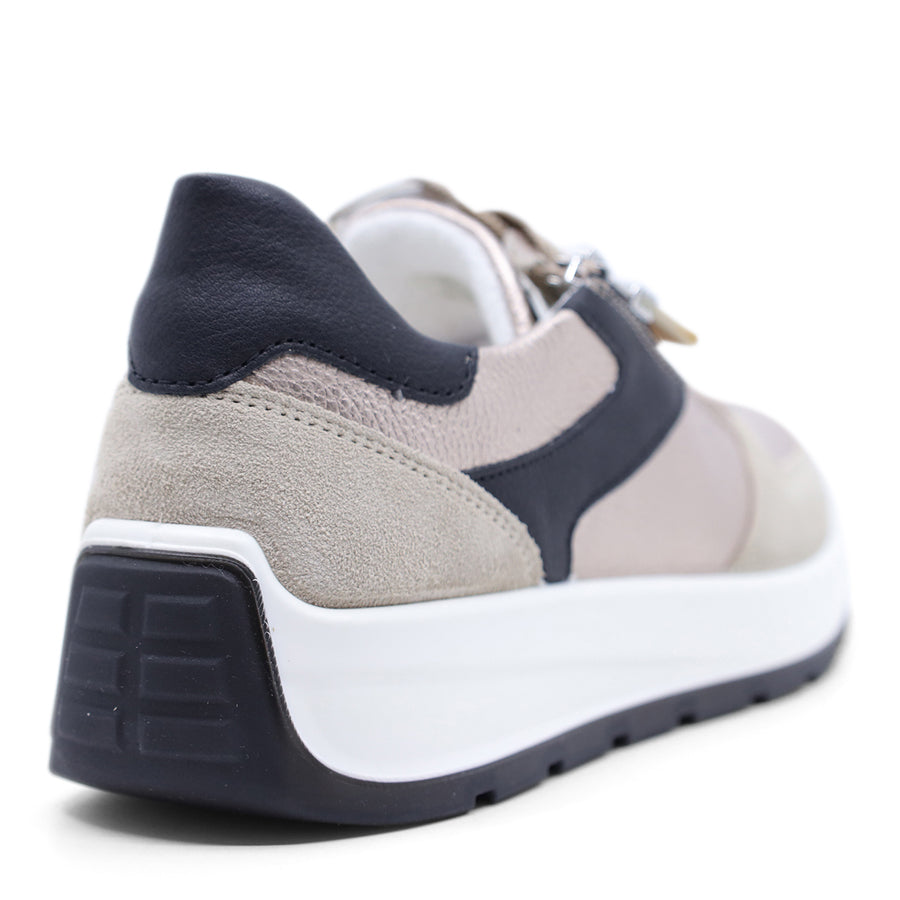 Grey metallic sneaker with black accents on a white background