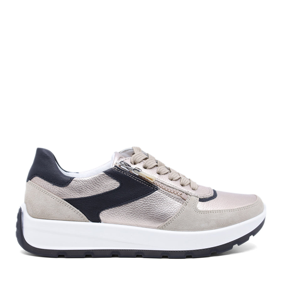 Grey metallic sneaker with black accents on a white background