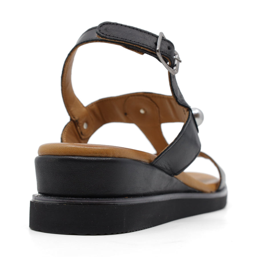 black sling back sandal with pearl detailing on front and side panels