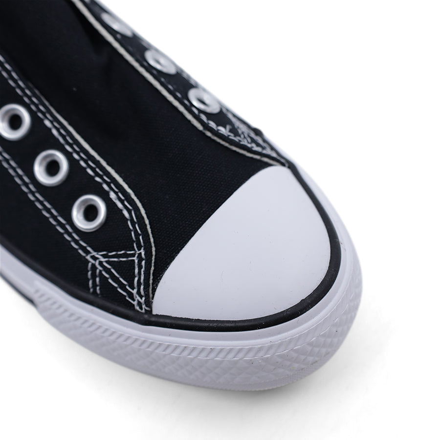 Black Converse slip on sneaker side view