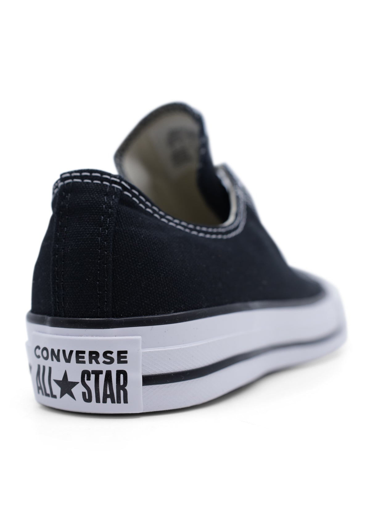 Black High top Converse slip on sneaker back view