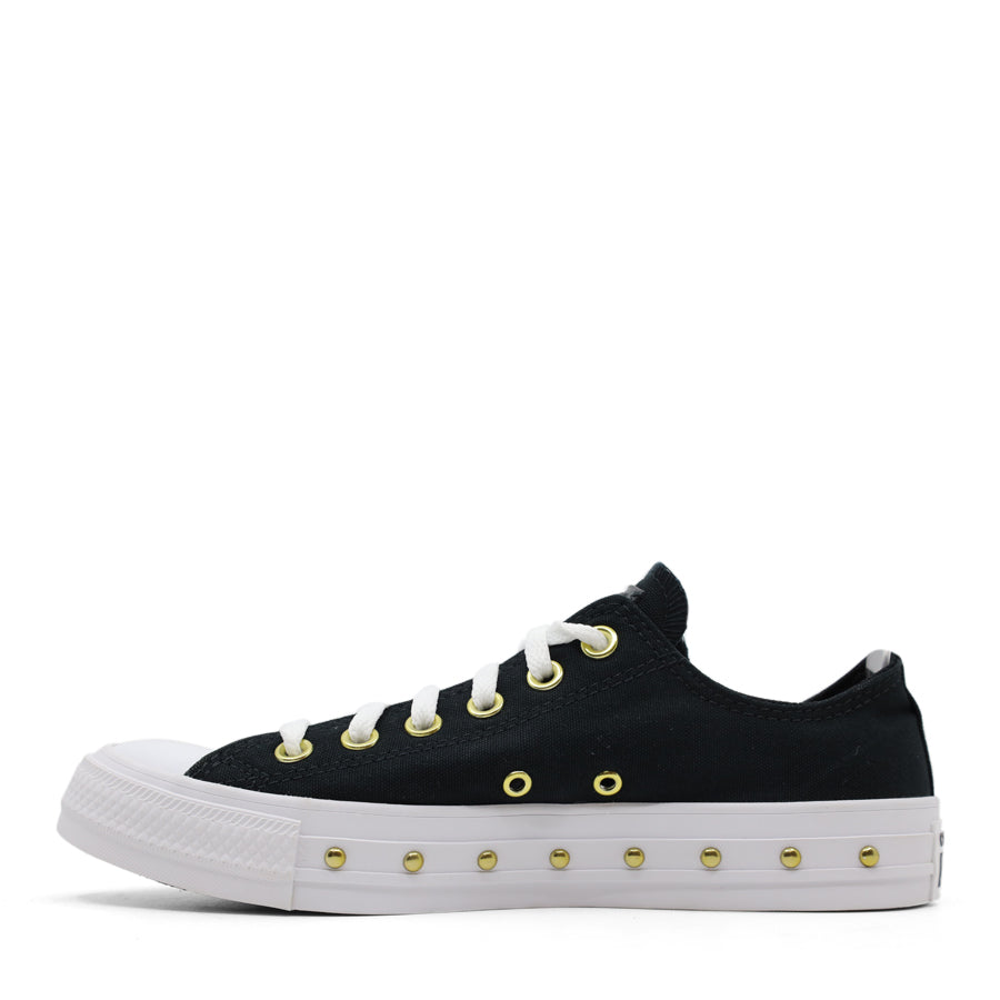 side view of black lace up sneaker with gold stud details along the white sole