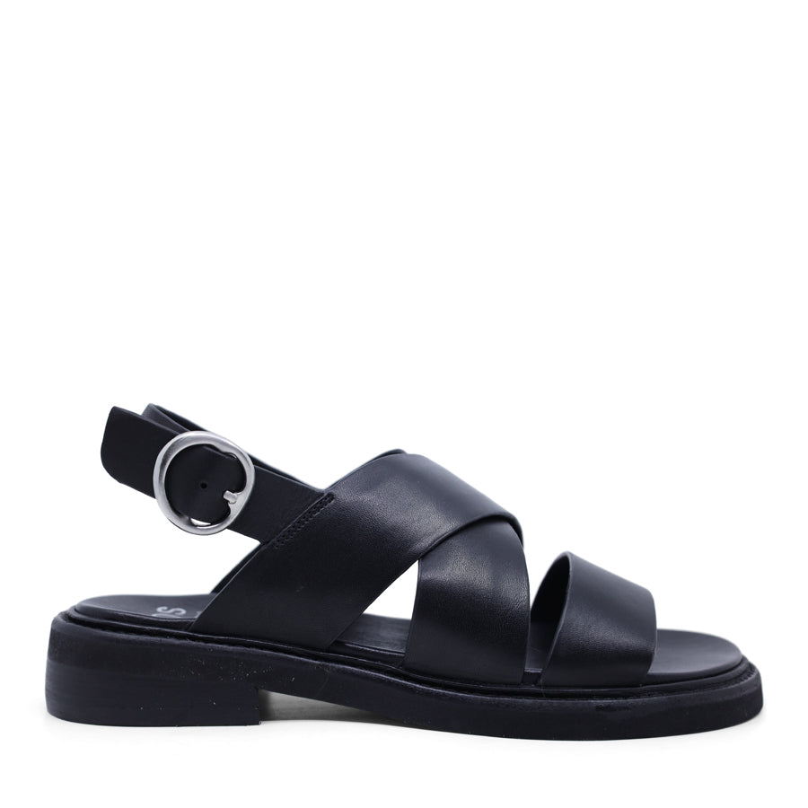 Black sandal with criss-cross straps and sling back buckle closure