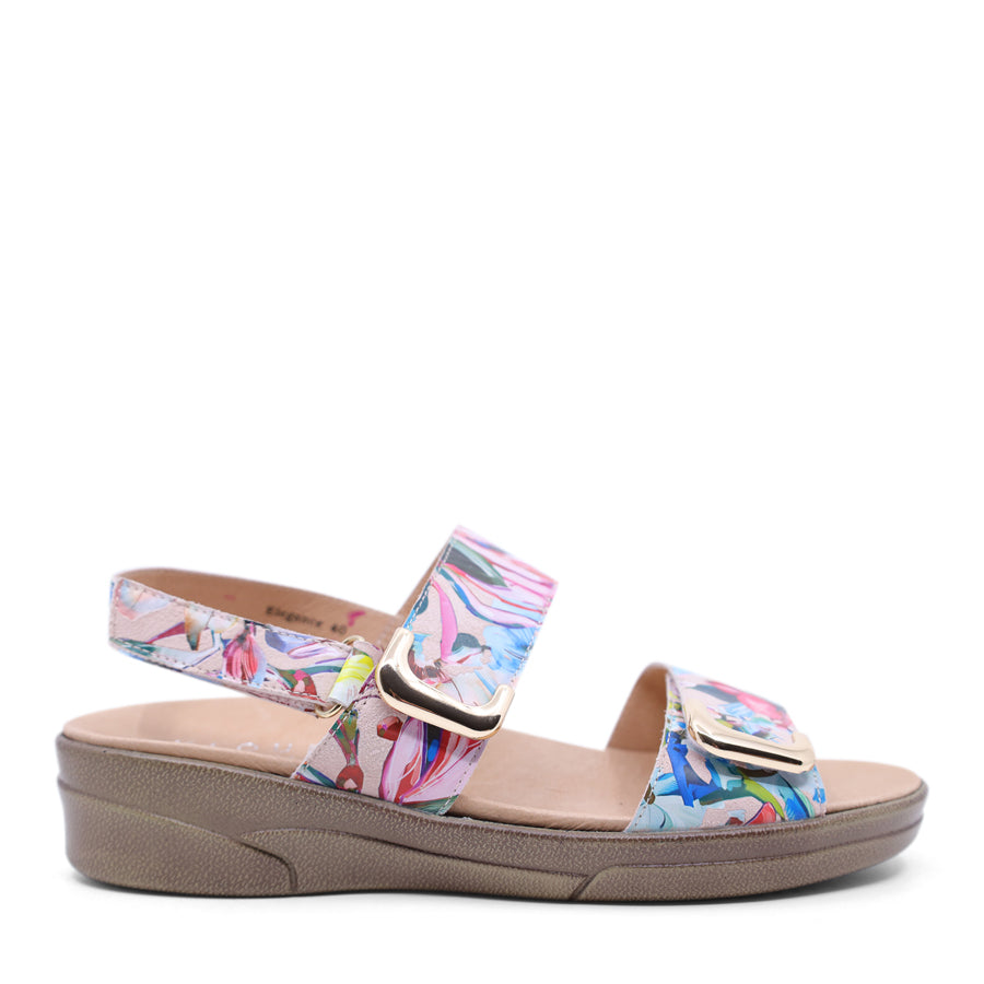  black leather velcro sandal with a buckle strap and a flat sole.