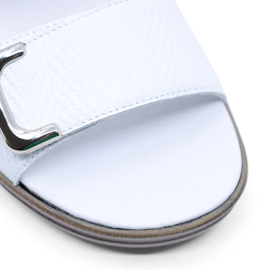 white print leather velcro sandal with a buckle strap and a flat sole.