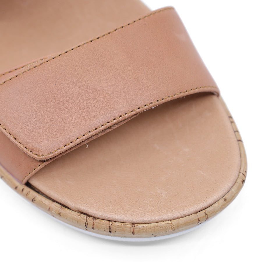 Tan brown sandal with cork wedge sole