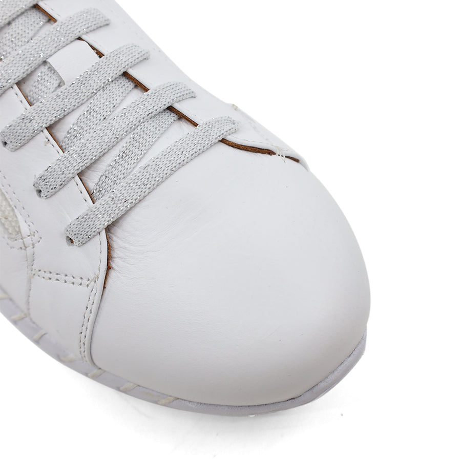 front view of white lace up sneaker with side zip