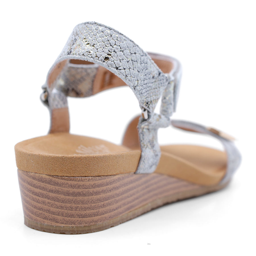 taupe snake wedge sandal with a wooden wedge sole and velcro strap