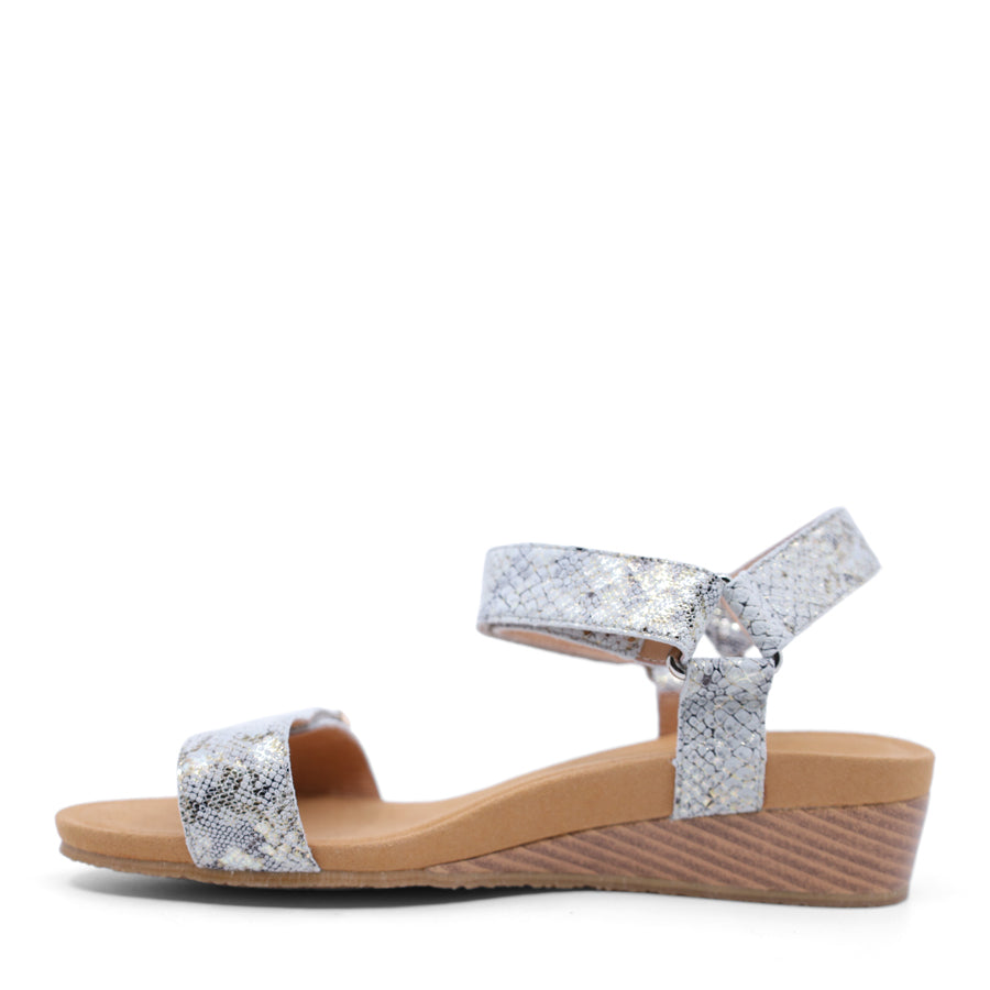 taupe snake wedge sandal with a wooden wedge sole and velcro strap