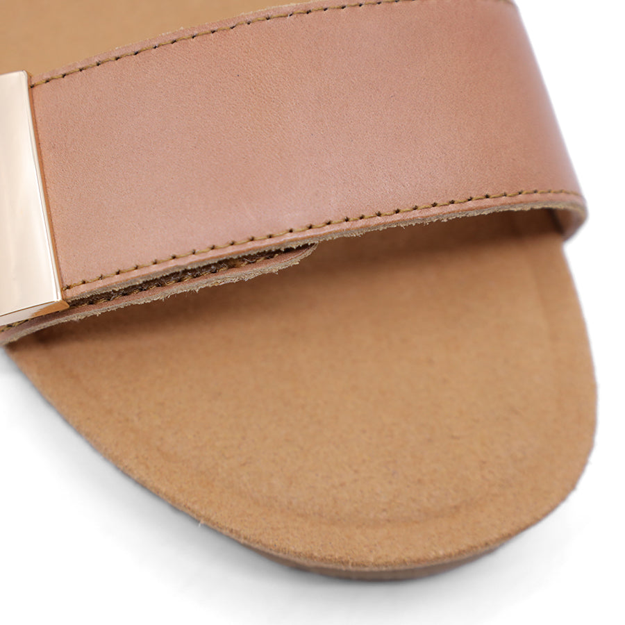tan brown wedge sandal with a wooden wedge sole and velcro strap